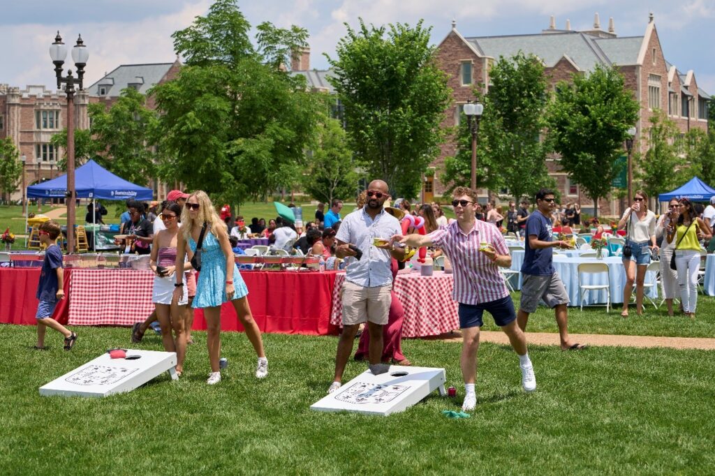 WashU alumni throwing bean bags at picnic