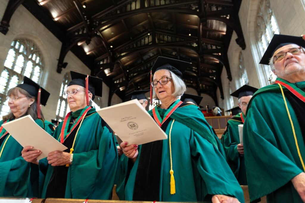 Reunion celebrants in green regalia singing