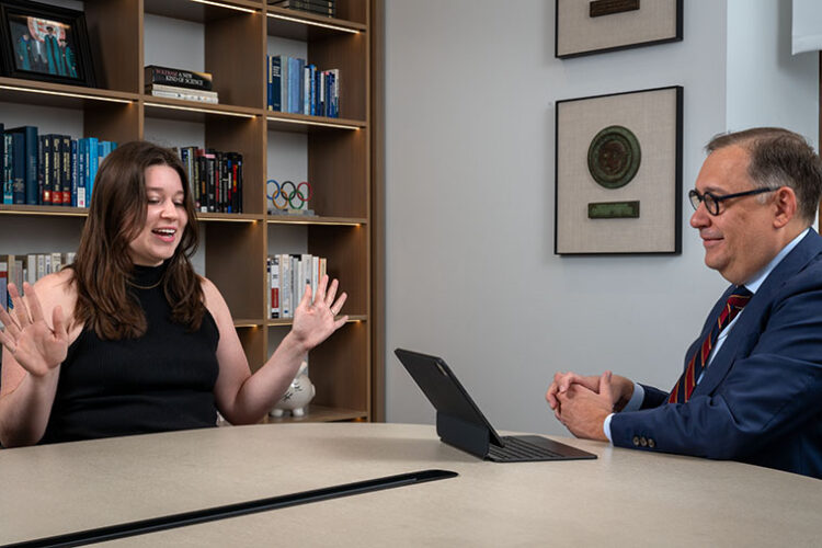 Andrew Martin, PhD, the Chancellor at Washington University in St. Louise, talks with recent graduate Julia Blanchard, '24