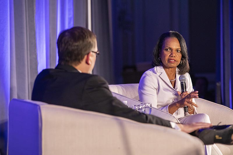 Chancellor Andrew Martin talks with former U.S. Secretary of Foreign Affairs Condaleeza Rice at the Eliot Society dinner in 2019