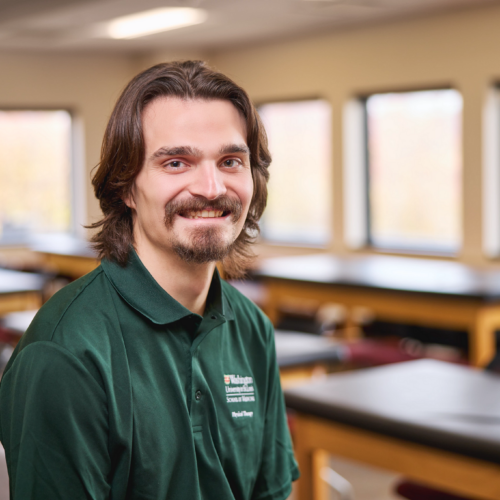 Leo Jacobs sitting in PT classroom